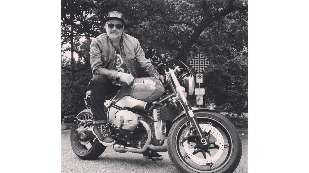 Black and white image of Art Green, founder of Road Astronaut, on his motorcycle.