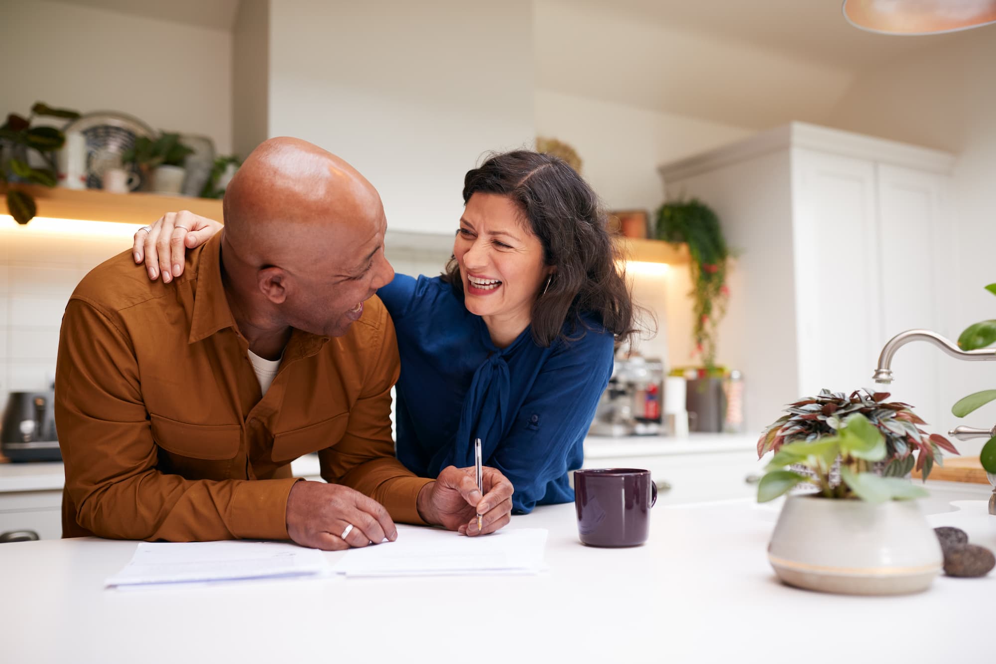 how_to_save_for_retirement_when_self_employed A mature couple celebrates after they learn how to save for retirement when self employed