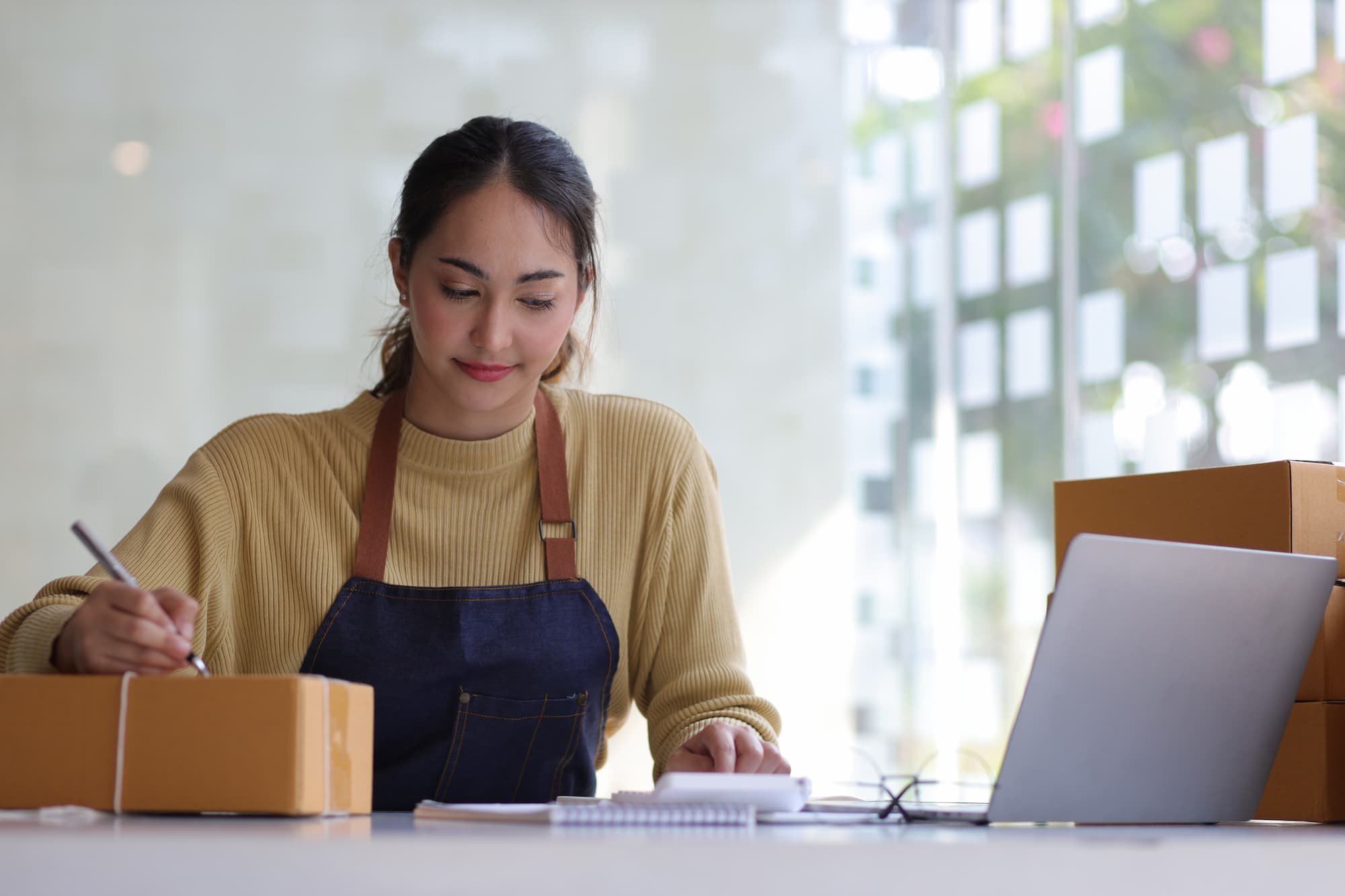 small_business_capital A young woman in an apron secures small business capital
